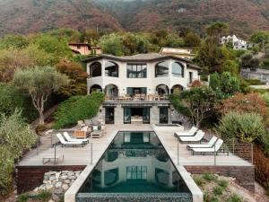 an aerial view of a house with a swimming pool at Villa MUSA in Lenno