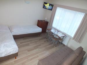 Postel nebo postele na pokoji v ubytování Piotruś Pan