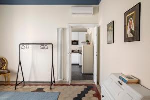 a white room with a refrigerator and a table at Residenza '900 in Castellanza
