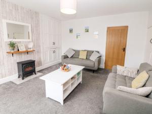 Khu vực ghế ngồi tại Harpur Cottage