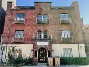 a brick building with windows and a door at Neyland View Condo - Heart of Downtown Knoxville in Knoxville