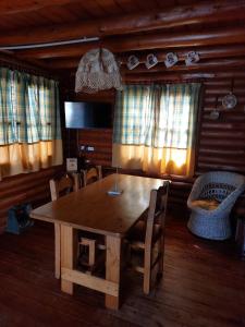 a wooden table and chairs in a room at Azul in Arroyo de Los Patos +121 photos