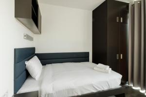 Rúm í herbergi á UCD Campus Accommodation