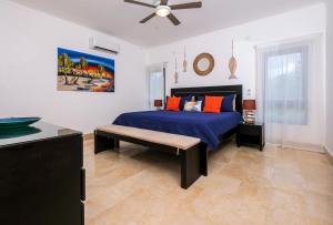 a bedroom with a bed and a ceiling fan at Amar'e Aparthotel & Spa in Las Terrenas