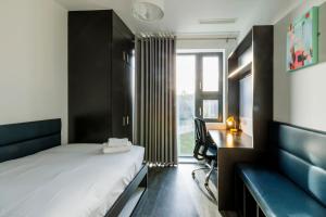 Rúm í herbergi á UCD Campus Accommodation