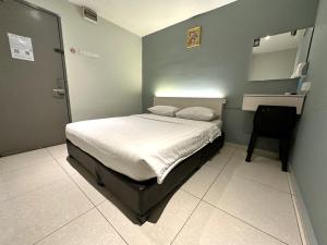 Postel nebo postele na pokoji v ubytování De UPTOWN Hotel @ SS2