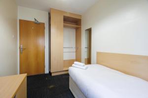 Rúm í herbergi á UCD Campus Accommodation