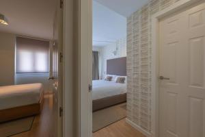 En eller flere senge i et værelse på AMAZONIA - Apartamento moderno centrico con Piscina Terraza y Parking + 13 billeder