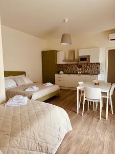 Postel nebo postele na pokoji v ubytování Fresia B&B