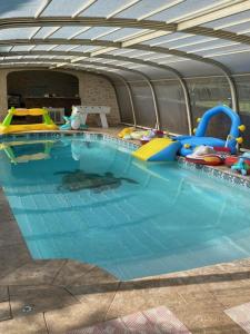 a large swimming pool with many toys in it at DIVO in Trans-en-Provence