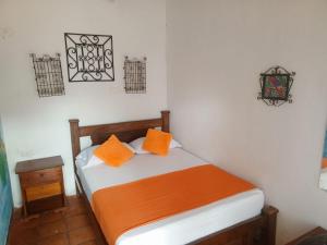 Hotel Viajero Mompox tesisinde bir odada yatak veya yataklar