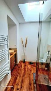 a bathroom with a toilet and a sink at Domaine de Cachaou Villa Leyr'ial sauna & spa in Salles