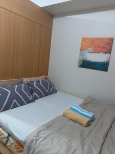 Säng eller sängar i ett rum på Shell Residences condotel Staycation