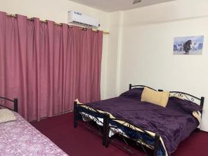 Ein Bett oder Betten in einem Zimmer der Unterkunft super deluxe for 8 guests apartment