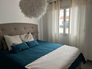 Postel nebo postele na pokoji v ubytování Villa Kaly,piscine privée plein sud, climatisation, internet