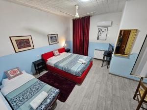 Postel nebo postele na pokoji v ubytování Hotel Giovannina