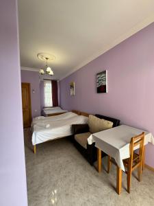 Letto o letti in una camera di Гостевой дом при кафе оазис