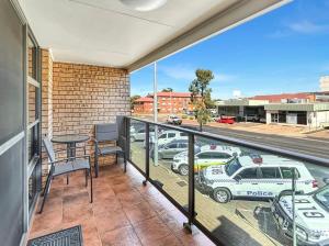 a balcony with a view of a parking lot at Glenmore Lodge - CBD Location, Hidden Gem in Dubbo