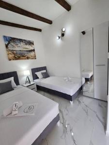 Ένα ή περισσότερα κρεβάτια σε δωμάτιο στο One-bedroom apartment, 5 min from the Airport Tivat