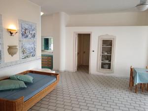 a bedroom with a bed and a table in it at Beach casa sul mare in Termoli
