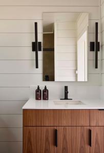 a bathroom with a sink and a mirror at AutoCamp Sequoia in Three Rivers