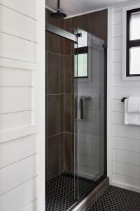 a shower with a glass door in a bathroom at AutoCamp Sequoia in Three Rivers