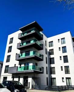 a large white building with balconies on it at Elegant Park Copou 2 rooms AB Homes in Iaşi