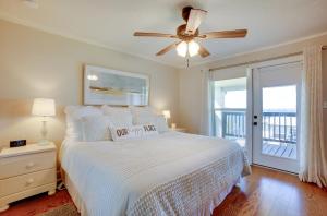 a bedroom with a bed and a ceiling fan at Spacious Livingston Home with Private Boat Dock in Livingston