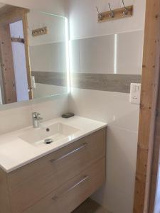 a bathroom with a sink and a mirror at Chalet Rekiano à Samoens - 5 pers in Samoëns