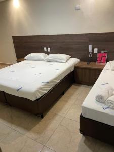 Postel nebo postele na pokoji v ubytování Hotel Belenzinho