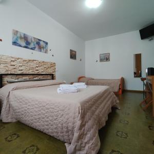 A bed or beds in a room at La Casetta Di Cotignola