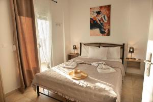 Postel nebo postele na pokoji v ubytování Afrathias Beachhouse - Cretan Hideaway