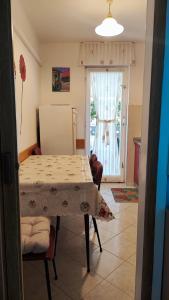 a dining room with a table and a window at Apartments Anić in Novigrad Istria