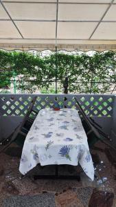 a table with a blanket on top of a porch at Apartments Anić in Novigrad Istria