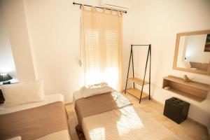Postel nebo postele na pokoji v ubytování Afrathias Beachhouse - Cretan Hideaway