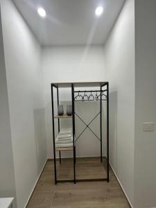 a room with a table with a chair and a mirror at Maison Number11 in Caserta +87 photos