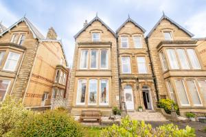 a group of houses in a row at Woodlands Holiday Apartments in Lytham St Annes
