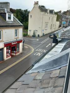 a view from a window of a street with buildings at Couple's Retreat-West Kilbride in Seamill