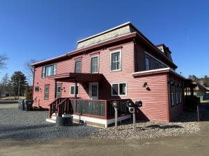 a large red house with a ramp in front of it at Berkshires Studio Apartment at the Stephentown Hotel in Hancock