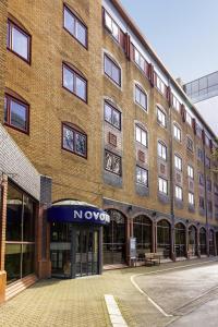 a large brick building with a novation sign on it at Novotel Bristol Centre in Bristol