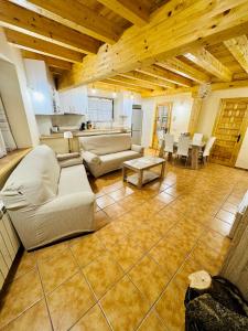 a large living room with a couch and a table at LA PORTADA DE ABAJO in Gallegos