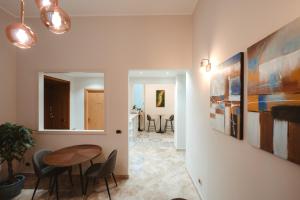 a dining room with a table and chairs at Lifestyle and Suites in Civitavecchia
