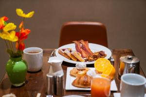 a table with two plates of breakfast food on it at Hilton San Francisco Union Square in San Francisco