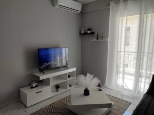 Телевизор и/или развлекательный центр в Amalia's Luxury Apartment