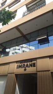 a sign for the entrance to an office building at Magnifique Appartement centre ville Kénitra in Kenitra