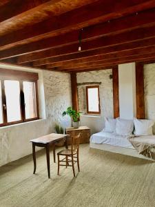 Postel nebo postele na pokoji v ubytování La Bastide d'Aigrefeuille