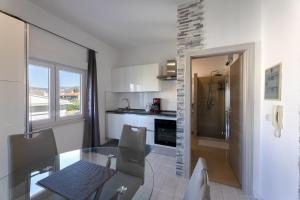 Kuchyň nebo kuchyňský kout v ubytování Apartments Bilopavlović