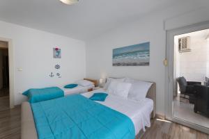 Postel nebo postele na pokoji v ubytování Apartments Bilopavlović + 37 fotografií