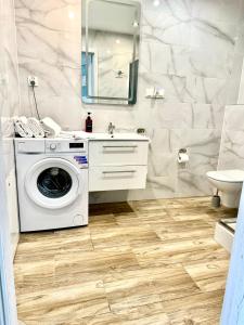 a bathroom with a washing machine and a sink at Zielona Mila in Sępólno Krajeńskie +67 photos