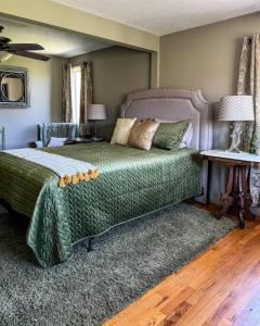 A bed or beds in a room at Appalachian Farmhouse- A Homestead Experience